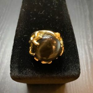 Kendra Scott black and gold ring.